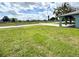 Green front lawn and covered entry with arched supports on a corner lot in a quiet neighborhood at 1207 Rich Moor Cir, Orlando, FL 32807