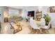 Bright and open living room with tile flooring, a day bed, and a dining area at 1207 Rich Moor Cir, Orlando, FL 32807