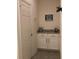 Hallway features white cabinets with granite countertop and tile flooring at 12126 Homestead Park Ln, Orlando, FL 32824