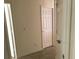 Hallway featuring neutral walls and white doors at 12126 Homestead Park Ln, Orlando, FL 32824