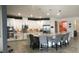 Large kitchen with island, granite countertops, white cabinets and stainless steel appliances at 12126 Homestead Park Ln, Orlando, FL 32824