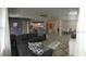 Spacious living area with tile flooring open to kitchen and dining areas at 12126 Homestead Park Ln, Orlando, FL 32824