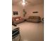 Cozy living room with neutral walls, tan sofas, and a ceiling fan at 12126 Homestead Park Ln, Orlando, FL 32824