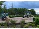 Community playground with slides and climbing structures for children at 12126 Homestead Park Ln, Orlando, FL 32824