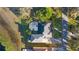 Aerial view of home featuring a large yard, pool, screened in enclosure and surrounding woods at 1320 Myrtle Dr, Longwood, FL 32750