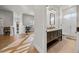 This is a full bathroom featuring a double vanity, modern lighting, and walk-in shower with glass door at 1320 Myrtle Dr, Longwood, FL 32750