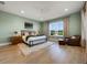 Spacious bedroom features a ceiling fan, and large window, offering lots of natural light at 1320 Myrtle Dr, Longwood, FL 32750