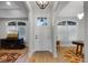 Elegant foyer with hardwood floors and a view into the living spaces at 1320 Myrtle Dr, Longwood, FL 32750