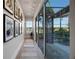 Hallway with light wood flooring, large glass doors and natural lighting at 1320 Myrtle Dr, Longwood, FL 32750