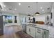 Bright open kitchen with stainless appliances, granite countertops and breakfast bar overlooking a sunroom at 1320 Myrtle Dr, Longwood, FL 32750