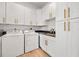 Laundry room with side-by-side washer and dryer, cabinets, and sink at 1320 Myrtle Dr, Longwood, FL 32750