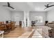 Spacious open-concept living area with wood floors, natural light, and a comfortable seating arrangement at 1320 Myrtle Dr, Longwood, FL 32750