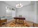 Bright office space with a modern light fixture and decorative area rug at 1320 Myrtle Dr, Longwood, FL 32750
