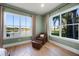 Cozy seating area in main bedroom with great natural lighting from two windows at 1320 Myrtle Dr, Longwood, FL 32750