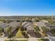Aerial view of the home showcases its landscaped yard and desirable location within a well-maintained community at 1392 Zeek Ridge St, Clermont, FL 34715