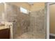 Modern bathroom with a glass-enclosed shower, tile accents, and contemporary fixtures at 1392 Zeek Ridge St, Clermont, FL 34715