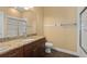 Clean bathroom with granite countertop, single sink, and a glass-enclosed shower at 1392 Zeek Ridge St, Clermont, FL 34715