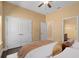 Relaxing bedroom showcasing a plush bed, ample closet space, and connecting bathroom at 1392 Zeek Ridge St, Clermont, FL 34715