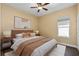 Cozy bedroom featuring a comfortable bed, side tables, and neutral decor for a relaxing atmosphere at 1392 Zeek Ridge St, Clermont, FL 34715