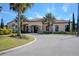 Community clubhouse showcasing stone accents, manicured landscaping, and ample parking for residents and guests at 1392 Zeek Ridge St, Clermont, FL 34715