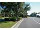 Gated community entrance with lush landscaping, providing privacy and security for residents at 1392 Zeek Ridge St, Clermont, FL 34715