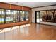 Bright fitness center with hardwood floors and large windows overlooking the community pool at 1392 Zeek Ridge St, Clermont, FL 34715