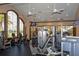 The community fitness center offers well-maintained modern workout equipment and lots of light from windows at 1392 Zeek Ridge St, Clermont, FL 34715