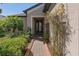 Inviting front entrance with a brick walkway and lush landscaping creating a warm welcome at 1392 Zeek Ridge St, Clermont, FL 34715