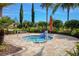 Relaxing community hot tub with a lift and beautiful tropical landscaping at 1392 Zeek Ridge St, Clermont, FL 34715