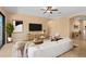 Bright living room featuring modern decor, a large TV, and access to the patio at 1392 Zeek Ridge St, Clermont, FL 34715