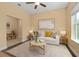 Comfortable living room with neutral tones, contemporary decor, and natural light at 1392 Zeek Ridge St, Clermont, FL 34715