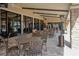 Charming patio area with tables, chairs and outdoor seating for relaxing and socializing at 1392 Zeek Ridge St, Clermont, FL 34715