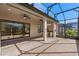 Enjoy outdoor living on this screened patio complete with brick pavers, ceiling fans, and summer kitchen at 1392 Zeek Ridge St, Clermont, FL 34715