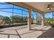 Spacious screened patio with brick flooring, offering serene views of the landscaped backyard at 1392 Zeek Ridge St, Clermont, FL 34715