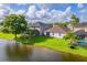Scenic aerial view of a backyard with a pool and lakefront property at 1401 Royal Saint George Dr, Orlando, FL 32828