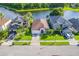 Aerial view of a well-maintained home near a serene lake at 1401 Royal Saint George Dr, Orlando, FL 32828