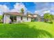 Expansive backyard with lush green grass, perfect for outdoor activities and relaxation at 1401 Royal Saint George Dr, Orlando, FL 32828