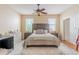Spacious main bedroom features a large bed, neutral colors, and wood flooring at 1401 Royal Saint George Dr, Orlando, FL 32828