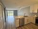 Bright, updated kitchen with modern appliances, stylish backsplash, and open layout at 14025 Fairway Island Dr # S, Orlando, FL 32837