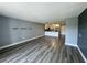 Open floor plan, kitchen and living space with wood-look floors and neutral paint colors at 14025 Fairway Island Dr # S, Orlando, FL 32837