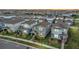 Aerial view of a well-maintained neighborhood featuring tidy homes and landscaped yards at 14146 Lanikai Beach Dr, Orlando, FL 32827