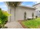 Charming entrance with stone walkway, planted greenery, and bench at 14146 Lanikai Beach Dr, Orlando, FL 32827