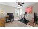 Comfortable bedroom with office space and ceiling fan, perfect for working at home at 14146 Lanikai Beach Dr, Orlando, FL 32827