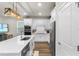 Bright kitchen featuring white cabinets, stainless steel appliances, and a center island at 14146 Lanikai Beach Dr, Orlando, FL 32827