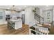 Bright kitchen featuring white cabinets, stainless steel appliances, and a center island at 14146 Lanikai Beach Dr, Orlando, FL 32827