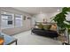 Relaxing living room area with carpet, couch, and bright natural light at 14146 Lanikai Beach Dr, Orlando, FL 32827