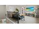 Cozy loft area with comfortable seating, a TV, and a modern cat tree at 14146 Lanikai Beach Dr, Orlando, FL 32827