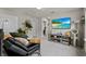 Comfortable loft space with a comfortable sofa, entertainment center, and a view of the hallway at 14146 Lanikai Beach Dr, Orlando, FL 32827