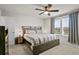 Comfortable main bedroom with ceiling fan and bright light at 14146 Lanikai Beach Dr, Orlando, FL 32827