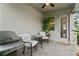 Cozy outdoor patio with comfortable seating, perfect for relaxing and entertaining at 14146 Lanikai Beach Dr, Orlando, FL 32827